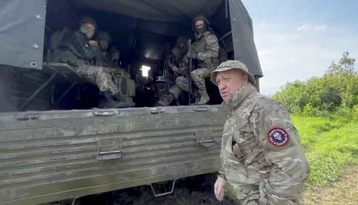 Founder of Wagner private mercenary group Yevgeny Prigozhin speaks with servicemen during withdrawal of his forces from Bakhmut and handing over their positions to regular Russian troops, in the course of Russia-Ukraine conflict in an unidentified location, Russian-controlled Ukraine, in this still image taken from video released June 1, 2023. —Reuters