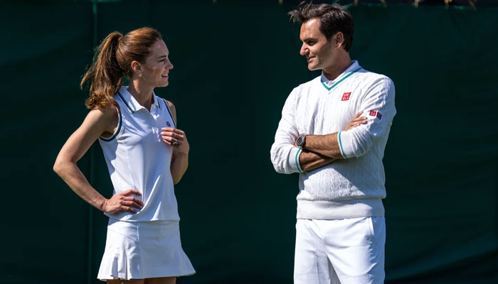 Catherine, Princess of Wales and eight-time Wimbledon champion Roger Federer talk before playing tennis.—CNN