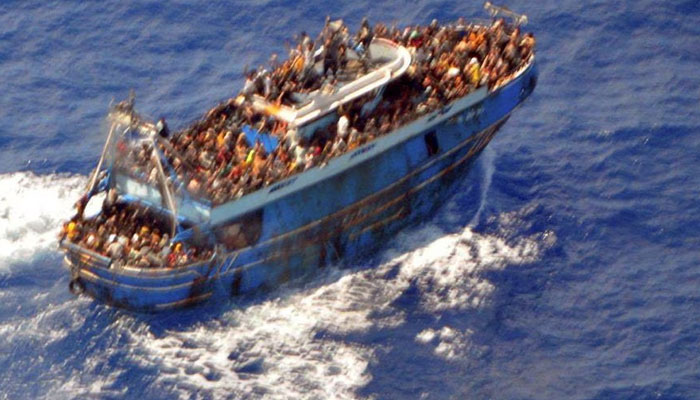 An undated handout photo provided by the Hellenic Coast Guard shows migrants onboard a boat during a rescue operation, before their boat capsized on the open sea, off Greece, June 14, 2023. — Reuters