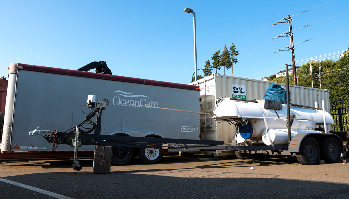 A trailer featuring the OceanGate logo is pictured near a trailer and other equipment at OceanGate Expedition´s headqurters in the Port of Everett Boat Yard in Everett, Washington, on June 22, 2023. — AFP