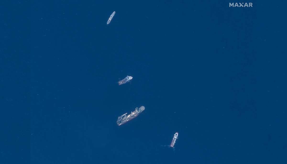 This June 22, 2023, satellite image courtesy of Maxar Technologies shows the Horizon Arctic (2nd from top), Deep Energy (C) and Skandi Vinland (bottom) searching on June 22, 2023, for the missing Titan submersible. — Reuters