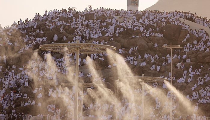 Muslim pilgrims gather on the Mount of Mercy at the plain of Arafat as water mist is sprayed due to high temperature during the annual haj pilgrimage, outside the holy city of Mecca, Saudi Arabia, June 27, 2023. — Reuters