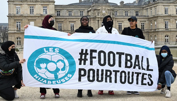 Supporters of the women soccer team Les Hijabeuses protest against controversial hijab ban in competitive sports in France. — AFP/File