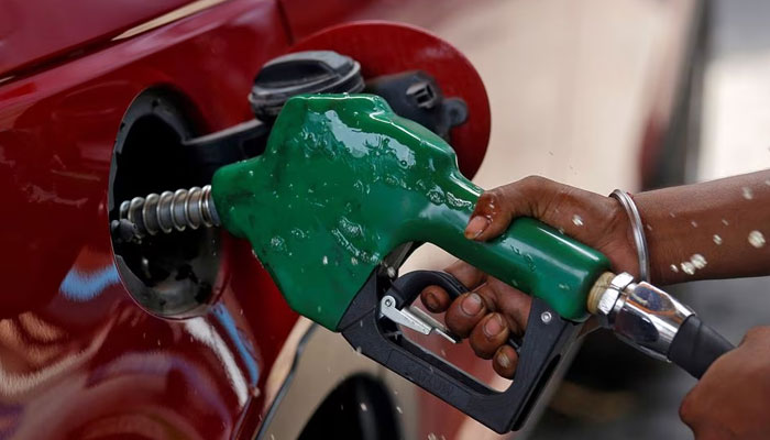 A vehicle is seen refueled with petrol at a fuel station in Mumbai June 25, 2010. — Reuters