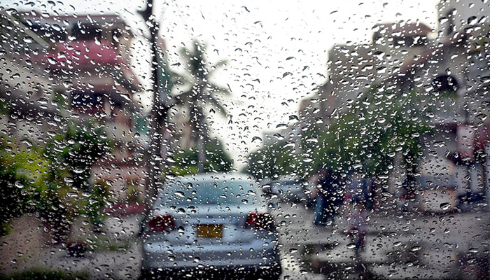 A car seen through a window with raindrops. — APP/File