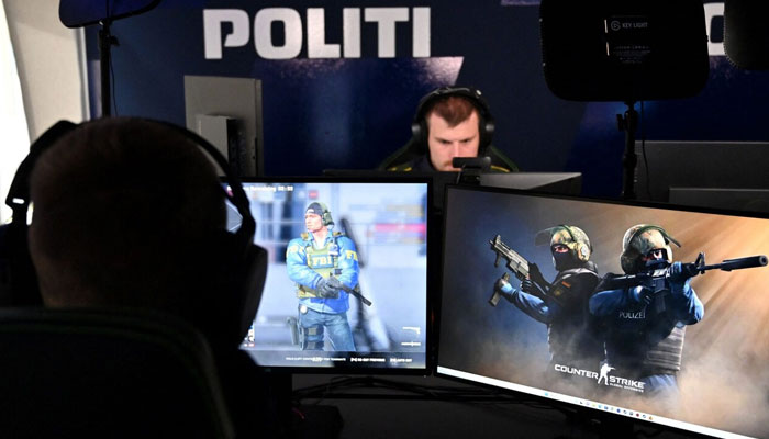 This picture shows Danish police on digital patrol. — AFP/File