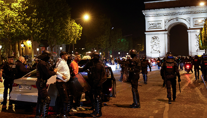 Police detain young people during the fifth night of protests following the death of Nahel, a 17-year-old teenager killed by a French police officer in Nanterre during a traffic stop, in the Champs Elysees area, in Paris, France, July 2, 2023. — Reuters