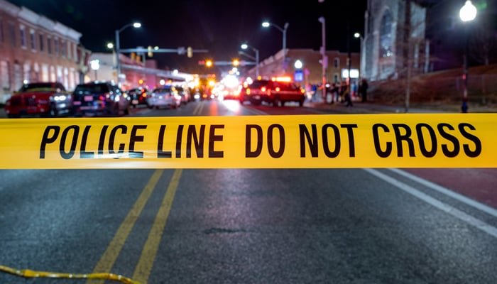 This image released by Baltimore Police Department shows a Police line after a mass shooting in the Brooklyn Homes area in south of city in state of Maryland on July 2, 2023. — Twitter/@BaltimorePolice