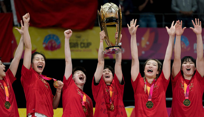 China players celebrate victory with the winners´ trophy after the end of the Women´ Asia Cup basketball final match between Japan and China in Sydney on July 2, 2023. — AFP