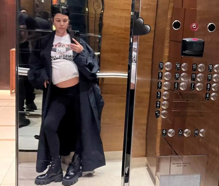 Kourtney Kardashian Barker displays her growing baby bump in elevator selfie