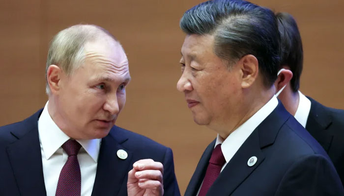 Russian President Vladimir Putin gestures while speaking to Chinese President Xi Jinping during the Shanghai Cooperation Organisation (SCO) summit in Samarkand, Uzbekistan, Sept. 16, 2022.  — Kremlin Pool Photo