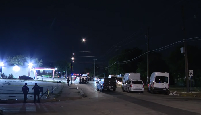 This screengrab shows a crime scene with police personnel investigating a shooting in Fort Worth, Texas on July 4, 2023. — YouTube/CBS Texas