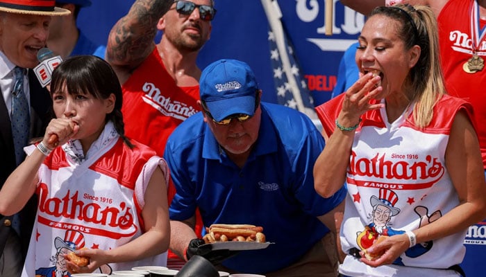 Mayoi Ebihara (left) and World Champion Miki Sudo (right) compete in the 2023 Nathans Famous Fourth of July International Hot Dog Eating Contest on July 4. — Reuters