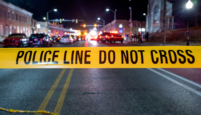 This image released by Baltimore Police Department shows a Police line after a mass shooting in the Brooklyn Homes area in the south of the city in the state of Maryland on July 2, 2023. — Twitter/@BaltimorePolice