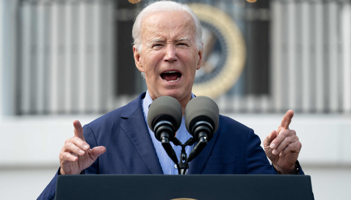 US President Joe Biden speaks during a barbeque for active-duty military families in honour of the Fourth of July on the South Lawn of the White House in Washington, DC, July 4, 2023. — AFP