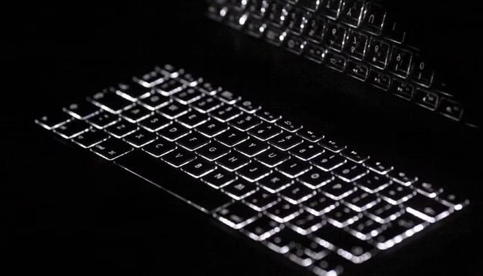 The backlit keyboard is reflected on the screen of an Apple Macbook Pro notebook computer in Warsaw. — Reuters/File