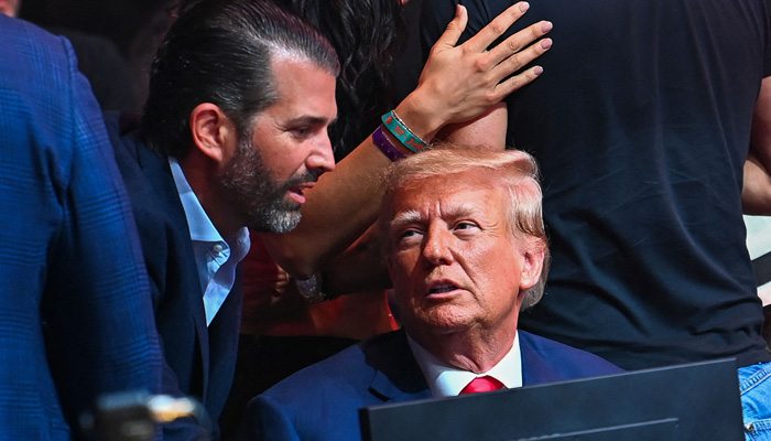 Former President Donald Trump and his son Donald Trump Jr attend the UFC 287 mixed martial arts event at the Kaseya Center in Miami, Florida, on April 8, 2023. — AFP