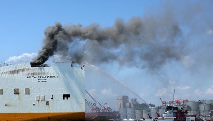 A New York City Fire Department (FDNY) fire boat sprays water on a cargo ship where two New Jersey firefighters were killed after they became trapped while battling a blaze, at Port Newark, New Jersey, US, July 6, 2023. — Reuters