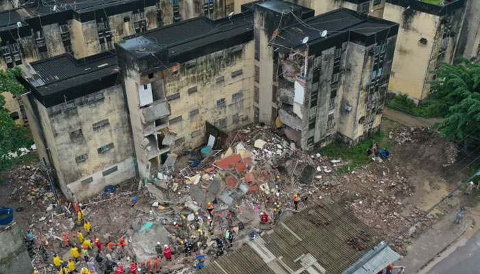 Rescue workers look for victims under the rubble of collapsed building in Recife, Pernambuco state, Brazil, on July 7, 2023. — Reuters