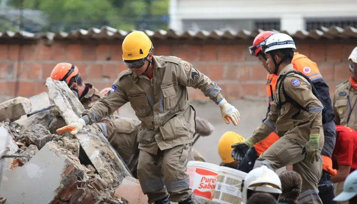 Rescue workers look for victims among the debris of a building collapse in Recife, Pernambuco state, Brazil, on July 7, 2023. — Reuters