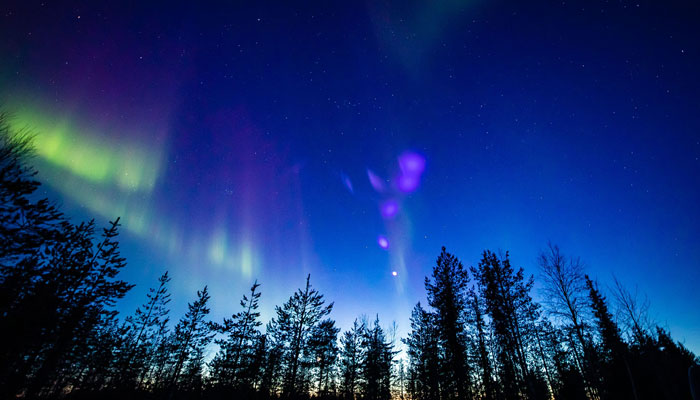 Picture taken on late March 23, 2023, shows colourful northern lights (Aurora borealis) appearing around the Arctic Circle near Rovaniemi, Finland. — AFP
