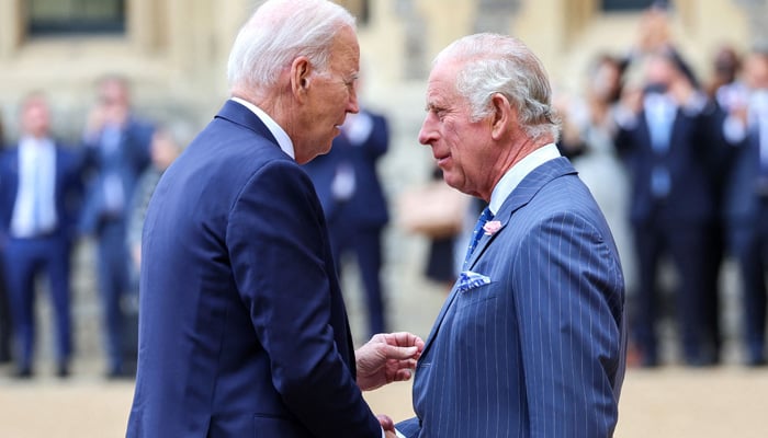 US President Joe Biden is greeted by Britain´s King Charles III greets during a ceremonial welcome in the Quadrangle at Windsor Castle in Windsor on July 10, 2023. — AFP