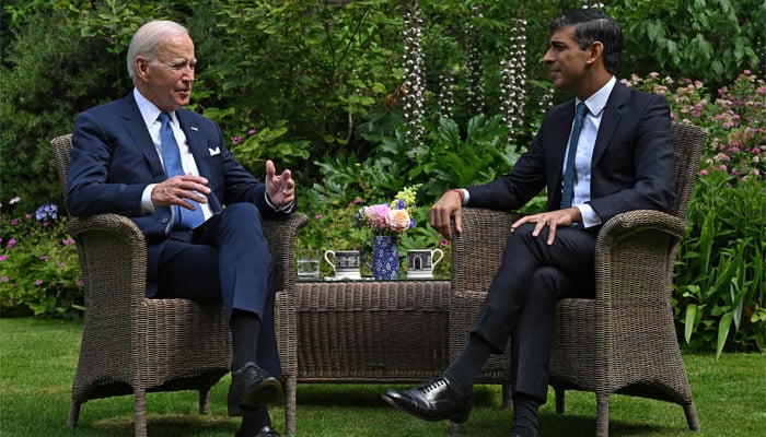 Britains Prime Minister Rishi Sunak and US President Joe Biden sit in the garden of 10 Downing Street in central London on July 10, 2023, during their meeting. — AFP