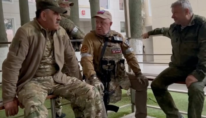 This picture shows Yevgeny Prigozhin (C) speaking with Lieutenant General Vladimir Alekseev (R) and Russian Defense Deputy Minister Yunus-Bek Evkurov (L) inside headquarters of Russian southern military district in city of Rostov-on-Don on June 24, 2023. — AFP