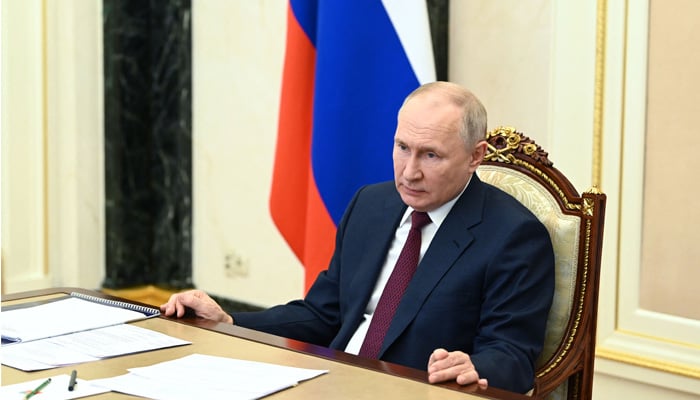 Russian President Vladimir Putin chairs a meeting with members of the government via a video conference at the Kremlin in Moscow on July 4, 2023. — AFP