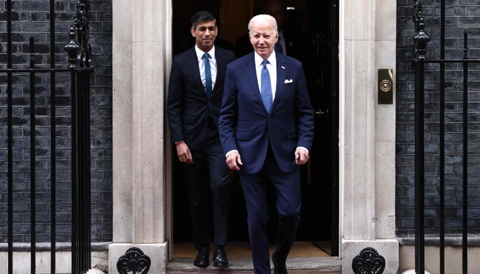 Britains PM Rishi Sunak (L) walks with President Joe Biden as he leaves from 10 Downing Street in central London on July 10, 2023, after a meeting. — AFP