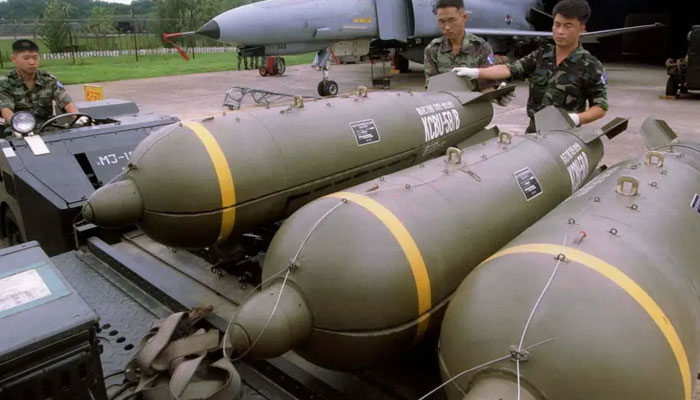 Members of the South Korean Air Force prepared to load cluster bombs onto a fighter during an exercise in August at an air base in Suwon, South Korea. — Reuters/File