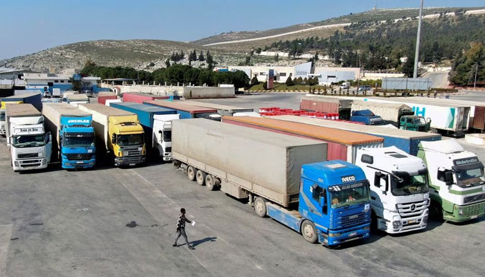 Trucks carrying aid from UN World Food Programme (WFP), following a deadly earthquake, are parked at Bab al-Hawa crossing, Syria February 20, 2023. — Reuters