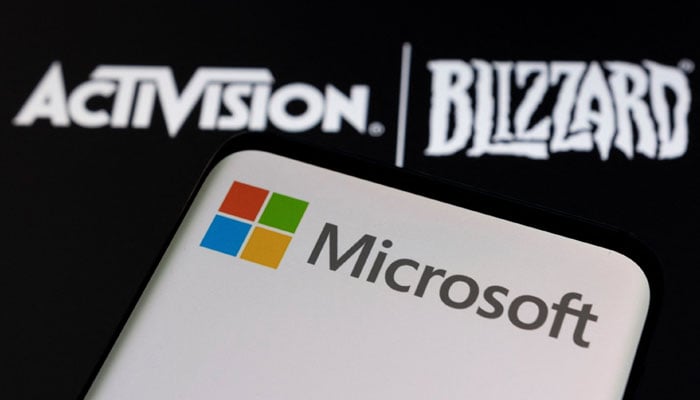 Microsoft logo is seen on a smartphone placed on displayed Activision Blizzard logo in this illustration taken on Jan. 18, 2022. — Reuters/File