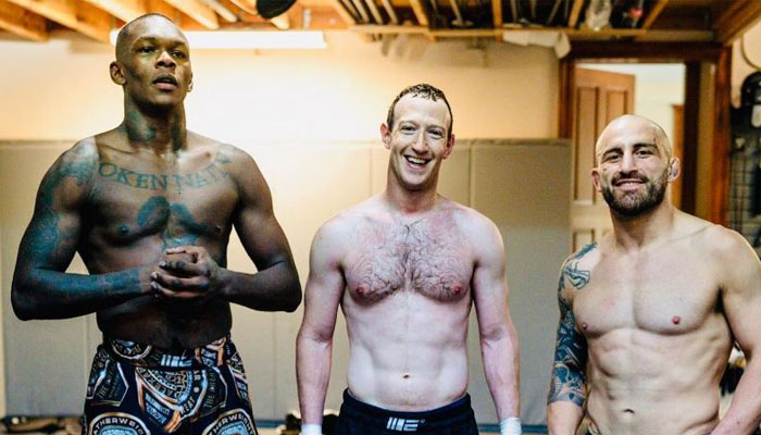 This picture shows UFC middleweight champion Israel Adesanya (left), Meta CEO Mark Zuckerberg and UFC featherweight champion Alexander Volkanovski posing after a training session. — Instagram/@zuck