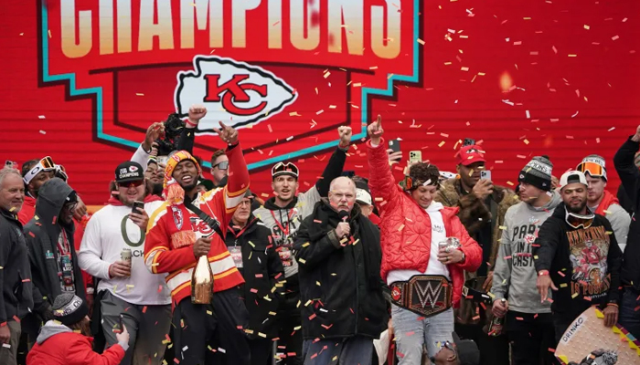 Kansas City Chiefs head coach Andy Reid celebrates with team during the Kansas City Chiefs Super Bowl parade. — USA Today Sports