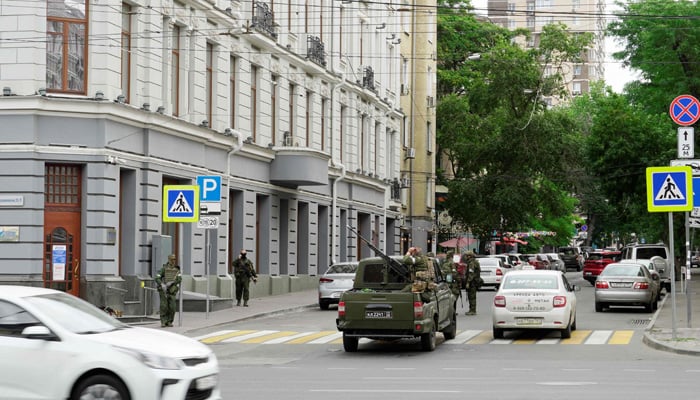 Members of Wagner group stand guard in a street in the city of Rostov-on-Don, on June 24, 2023. — AFP