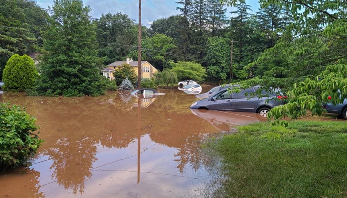 A place can be seen flooded with water as flash floods swept across the Bucks County area near Washington Crossing Road on July 15, 2023. — Facebook/Jim Friedman via Lower Makefield Township Police Department