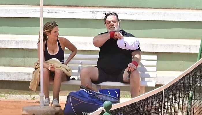 Russell Crowe is seen playing tennis with girlfriend Britney Theriot