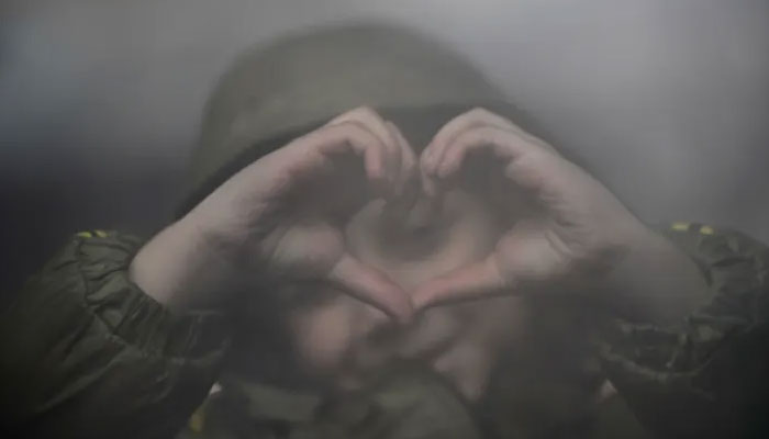 A refugee child fleeing Ukraine gestures while waiting for transportation at Nyugati station, in Budapest, Hungary, on February 28, 2022. — Reuters