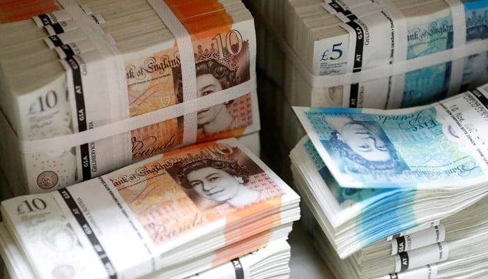 Wads of British Pound Sterling banknotes are stacked in piles at the Money Service Austria companys headquarters in Vienna, Austria, November 16, 2017. — Reuters