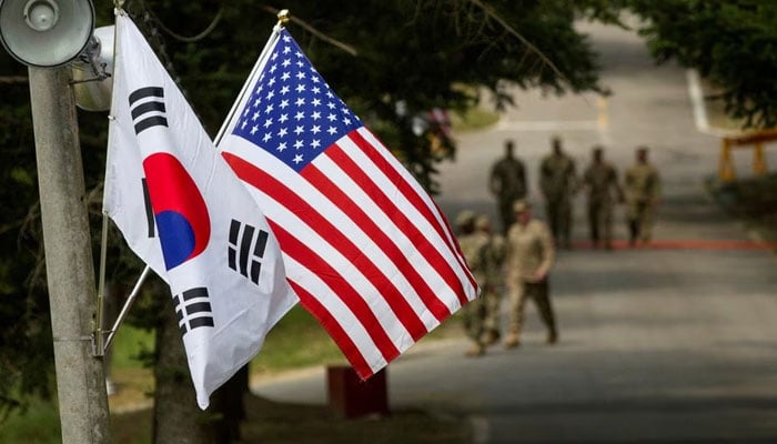 The South Korean and American flags fly next to each other at Yongin, South Korea. — Reuters/File