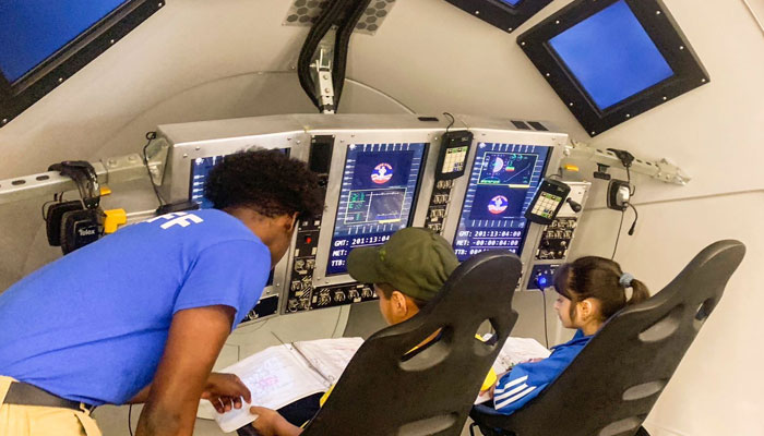 An official is guiding students at the Space Camp in Huntsville. — US Consulate General Karachi