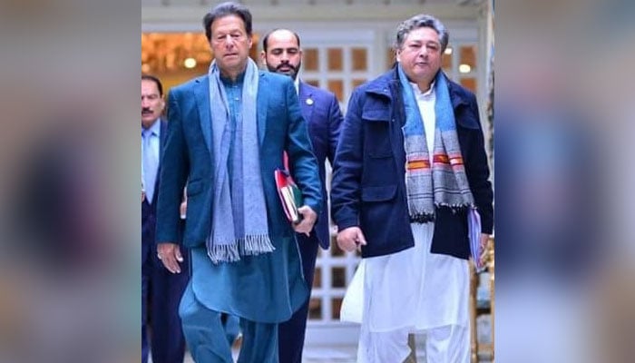 Former prime minister Imran Khan (left) and his then-principal secretary Azam Khan. — Facebook/PTI/File