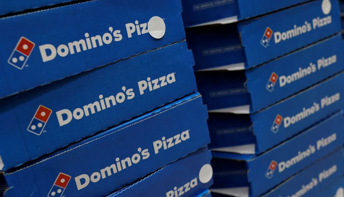 Dominos pizza boxes are pictured inside a restaurant in Noida, India, July 4, 2023. — Reuters