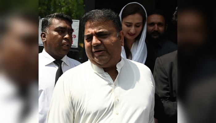 Fawad Chaudhry leaves the ECP office in Islamabad on August 2, 2022. — AFP