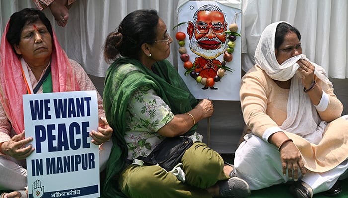 Members of the All India Mahila (AIMC) Congress hold placards during a protest over sexual violence against women and for peace in the ongoing ethnic violence in India´s north-eastern state of Manipur, in New Delhi on July 20, 2023. — AFP