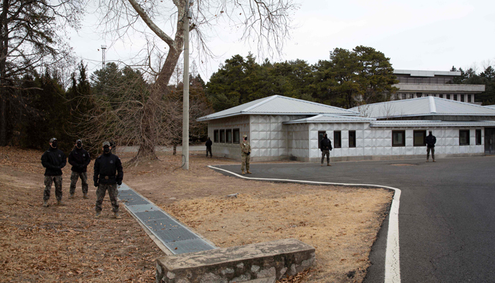 South Korean soldiers stand guard during a media tour of the Joint Security Area (JSA) in the Demilitarized Zone (DMZ) in the border village of Panmunjom in Paju on 03 March 2023. — AFP