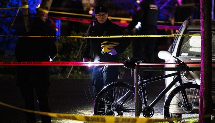 A police officer views the crime scene, where a mass shooting took place in Portland, Oregon, US. — Reuters/File