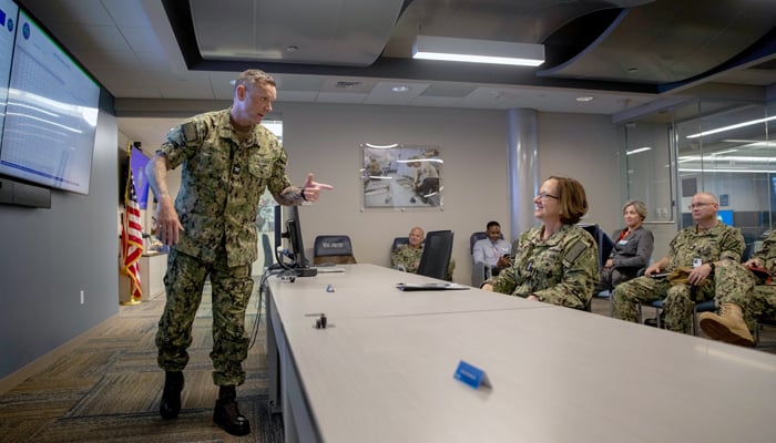 Vice Chief of Naval Operations Admiral Lisa Franchetti, listens to Captain Ronnie Harper, director of the Maintenance Operation Center, during a briefing on May 24, 2024. — US Navy website