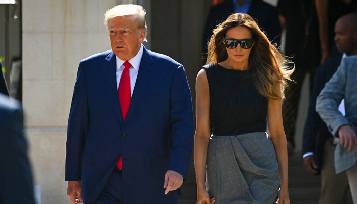 Former US President Donald Trump and his wife, Melania Trump, leave a polling station after voting in the US midterm elections in Palm Beach, Florida, on November 8, 2022. — AFP